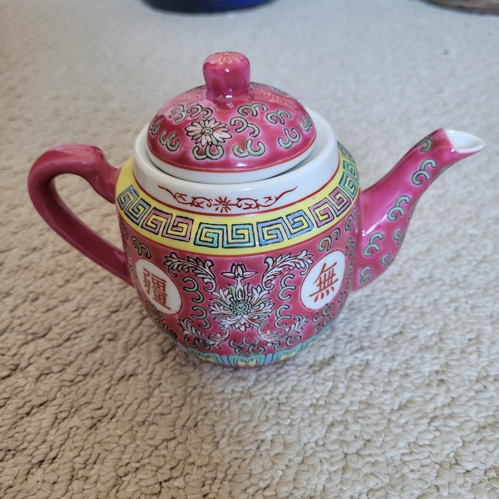 Elegant Pink Chinese Teapot with Intricate Design